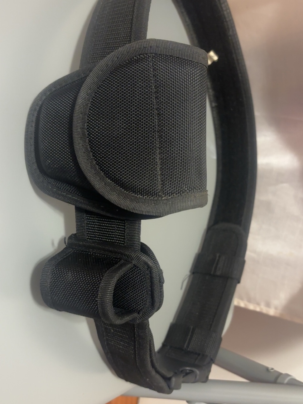 Black heavy duty belt with handcuff and flashlight holder
